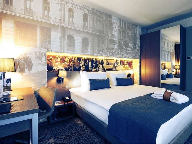 Modern Superior Room with workspace, perfect for corporate bookings and speaker accommodation.