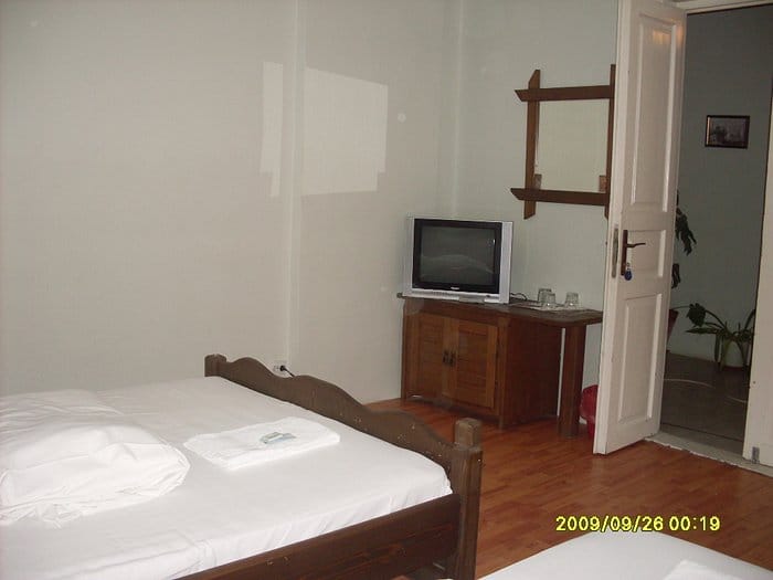 Superior Room at Oana Accommodation with dated furnishings, hotel booking, event lodging.