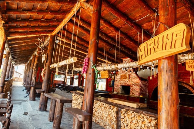 Rustic open-air restaurant at Pensiunea Miruna for casual teambuilding and welcome receptions.