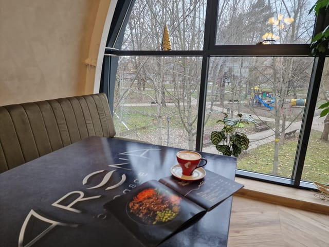 Cozy restaurant booth at Pensiunea Casa EMA, ideal for private meetings and business events.