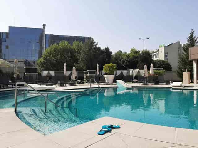 Ramada Plaza Bucharest outdoor pool deck for corporate networking events and conference receptions.