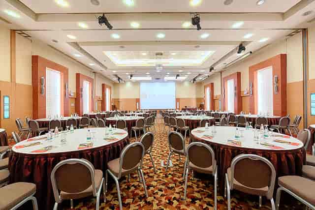 Ramada Plaza Bucharest ballroom with banquet setup for corporate conferences and gala events.