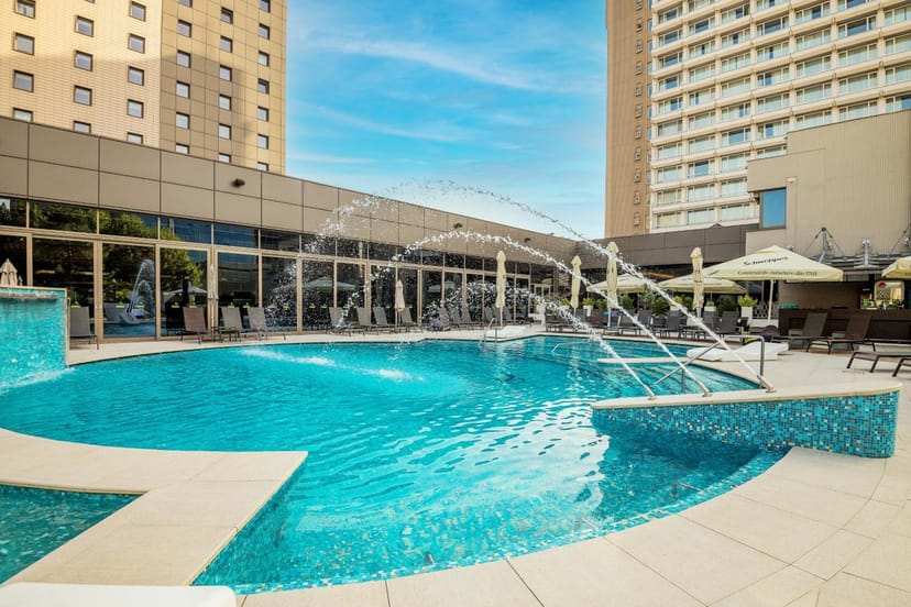 Resort-style pool deck at Ramada Plaza Bucharest for networking mixers and corporate events.