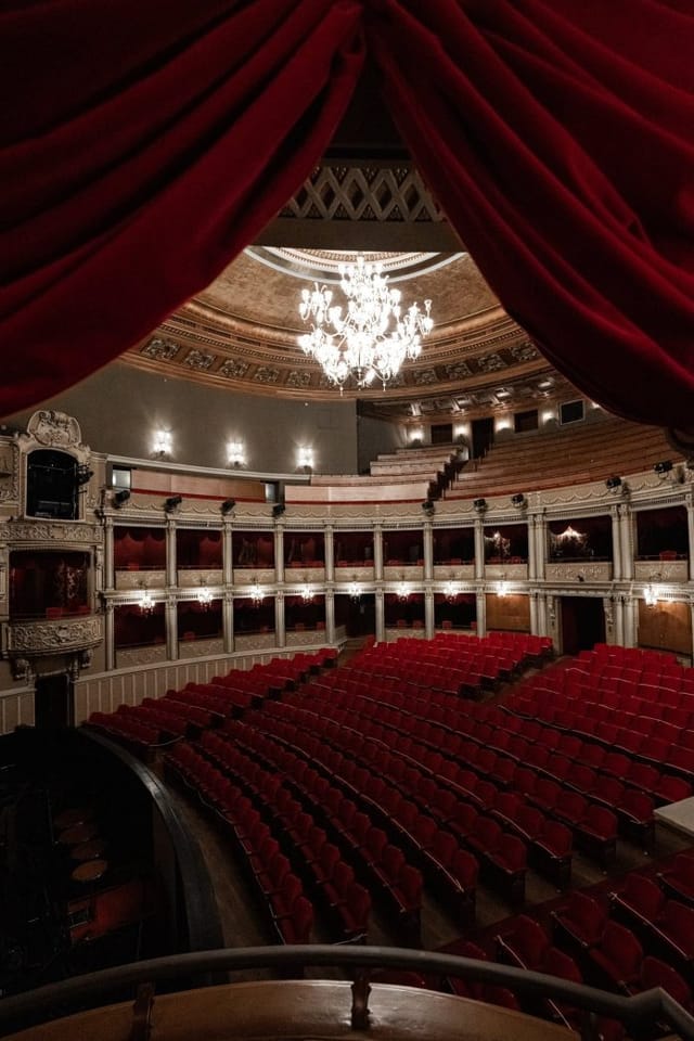 Historic Opera Națională București auditorium for keynote sessions and awards galas.