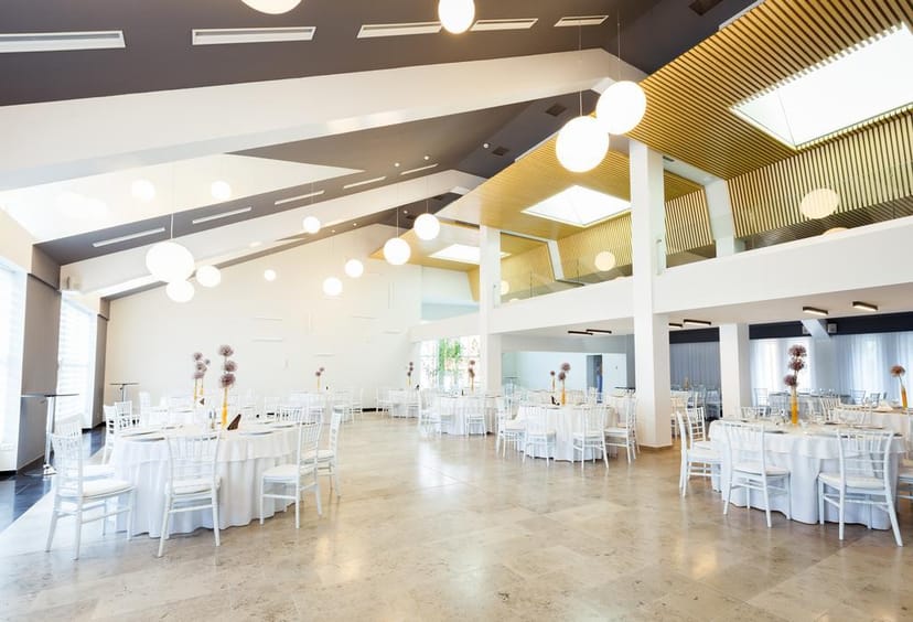 Modern Hotel Bistrita conference room, high ceilings, corporate gala venue, social event space.