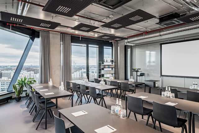 Modern meeting room with natural light for corporate workshops and seminars at Atlas City Hotel.
