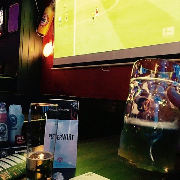 Branded beverage service at Abseits Rockbar Munich for an informal sponsored viewing event.