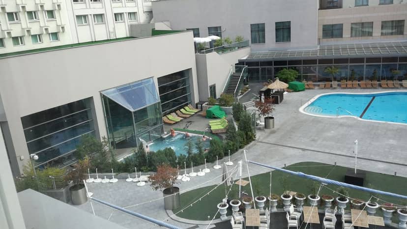 Outdoor event space with pool at Park Inn Bucharest for networking and social gatherings.