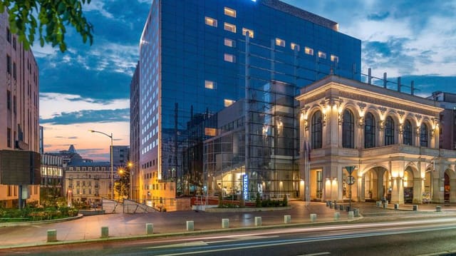Winestone venue in Novotel Bucharest, sleek glass facade for events and gatherings.