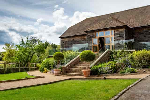 Outdoor garden at Brookfield Barn with manicured landscaping for events and celebrations.