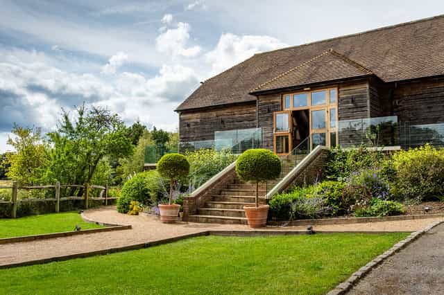 Outdoor garden at Brookfield Barn with manicured landscaping for events and celebrations.