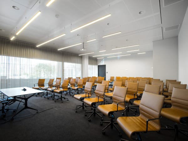 Modern theater-style auditorium, Atrium Amsterdam, professional conference and workshop venue.