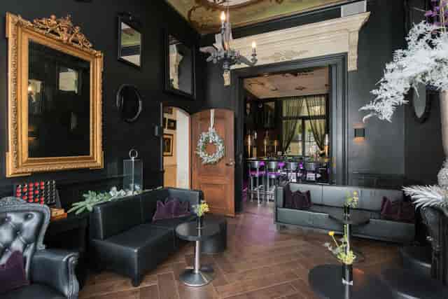 Luxury lounge bar with plush leather seating for VIP receptions and exclusive cocktail events.