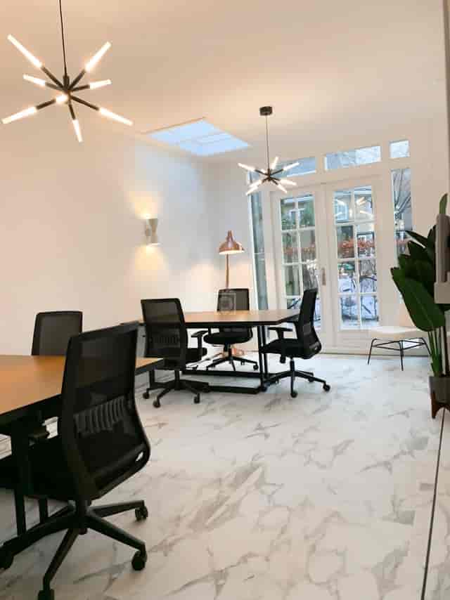 Private office breakout room with natural light for corporate strategy sessions and interviews.