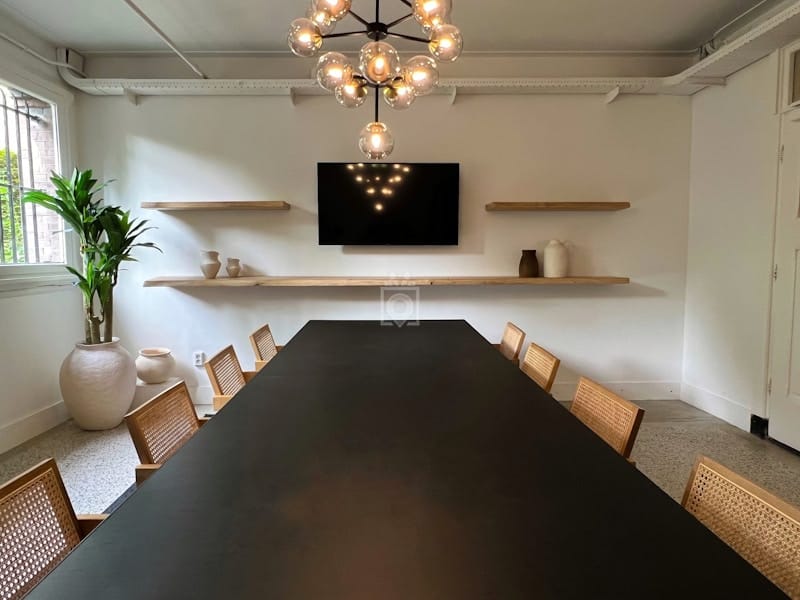 Modern boardroom with AV integration for professional client pitches and executive meetings.