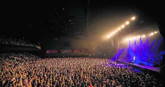 AFAS Live concert hall with dynamic stage lighting for high-capacity music events.