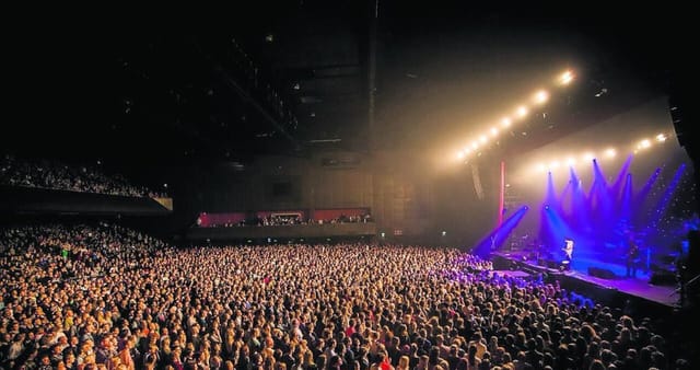 AFAS Live concert hall with dynamic stage lighting for high-capacity music events.