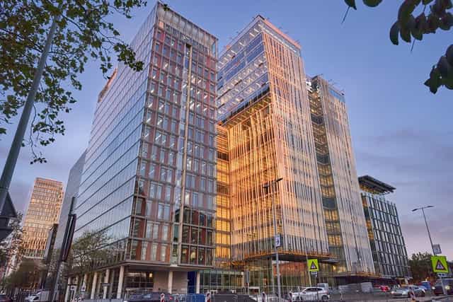 Modern glass-fronted WTC Amsterdam office for corporate conferences and executive retreats.