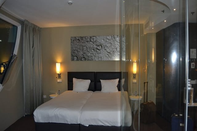 Modern Fletcher Hotel Amsterdam room with split beds for corporate travel and business events.
