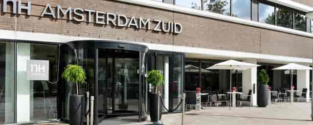 NH Amsterdam Zuid exterior arrival area and terrace for professional corporate event networking.