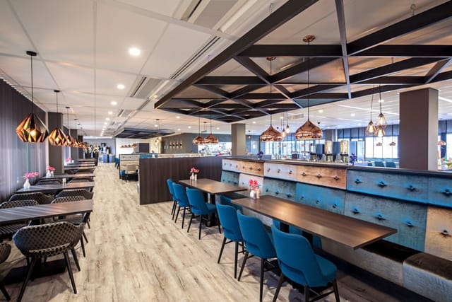 Modern restaurant venue in Amsterdam with banquette seating for networking and workshops.