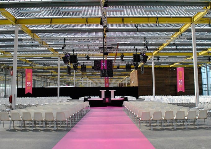Auditorium at EXPO Greater Amsterdam with stage and branding for corporate events and conferences.