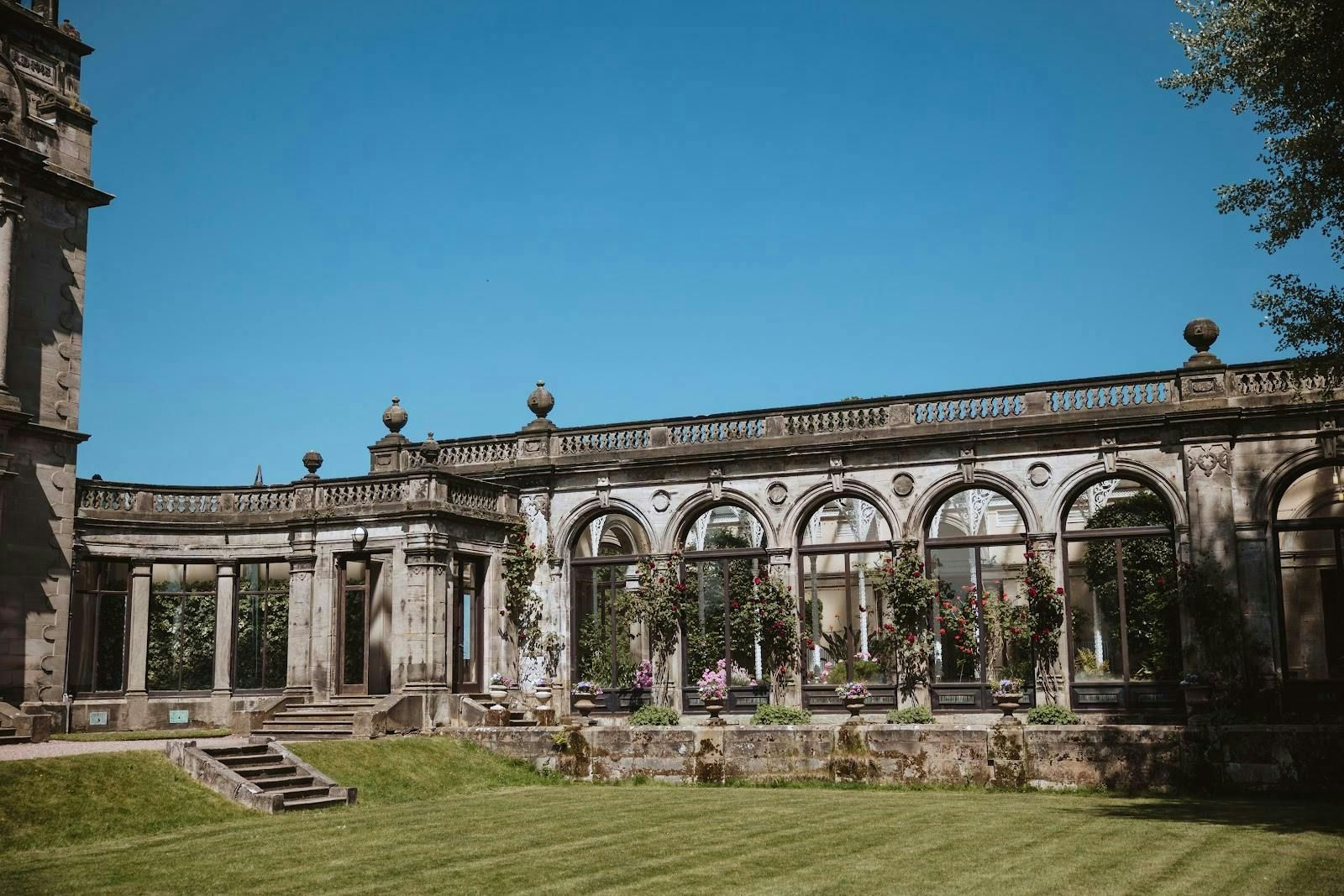 Elegant wedding marquee at Sandon Hall with arched windows, perfect for upscale events.