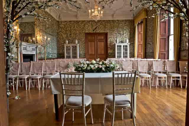 Charming Tipi Receptions: elegant floral decor and seating for intimate weddings or gatherings.