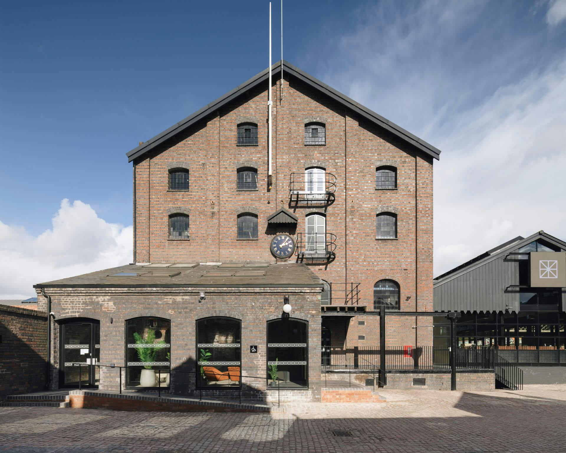 Charming industrial meeting rooms with rustic brick, ideal for unique corporate events.