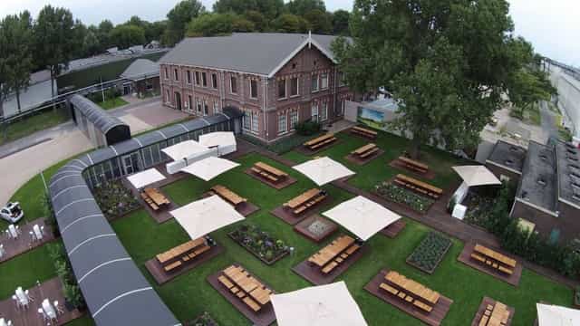 Jeanne d’Arc outdoor venue with rustic decor, ideal for corporate networking and breakout events.