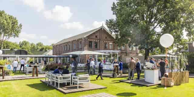 Modular outdoor networking space with tiered seating for corporate events and business meetings.