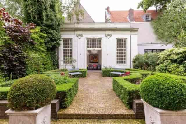 Garden level banquet hall with manicured courtyard for upscale garden receptions and meetings.