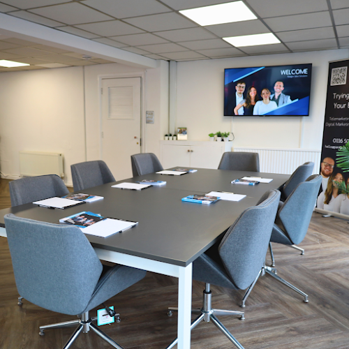 Studio Two boardroom with 8-seat setup for corporate meetings and professional client briefings. - Banner