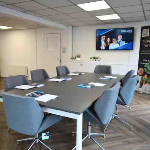 Studio Two boardroom with 8-seat setup for corporate meetings and professional client briefings.