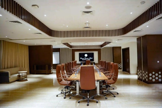 Boardroom at Ramee Royal Hotel for executive meetings and corporate events.
