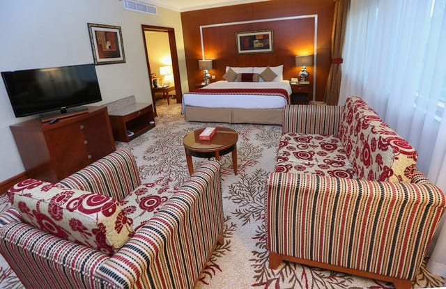 Spacious VIP hotel suite with lounge area for executive business meetings and corporate events.