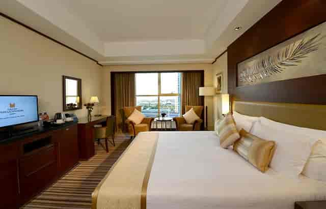 Grand Millennium Dubai hotel suite with ergonomic workspace for corporate events and business travel.