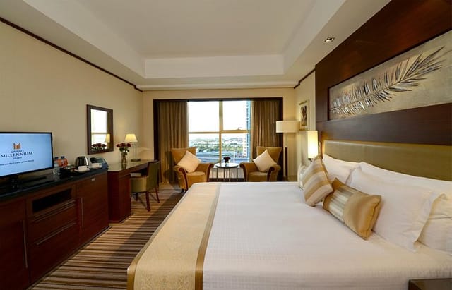 Grand Millennium Dubai hotel suite with ergonomic workspace for corporate events and business travel.