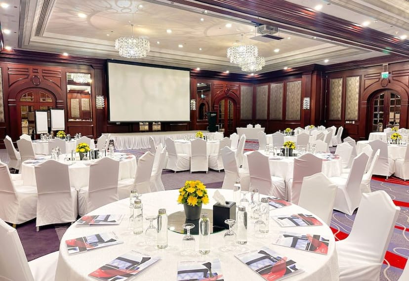 Grand Ballroom with wood-paneled decor for corporate conference and event venue setup.