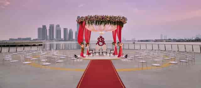 Open-air wedding ceremony with skyline backdrop at InterContinental event venue.