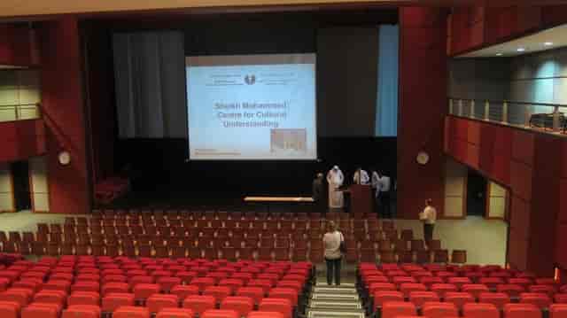 Raked auditorium seating for event planning and corporate conference setup.