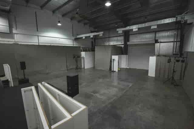 Industrial warehouse event space with exposed concrete, perfect for venue hire and event production.