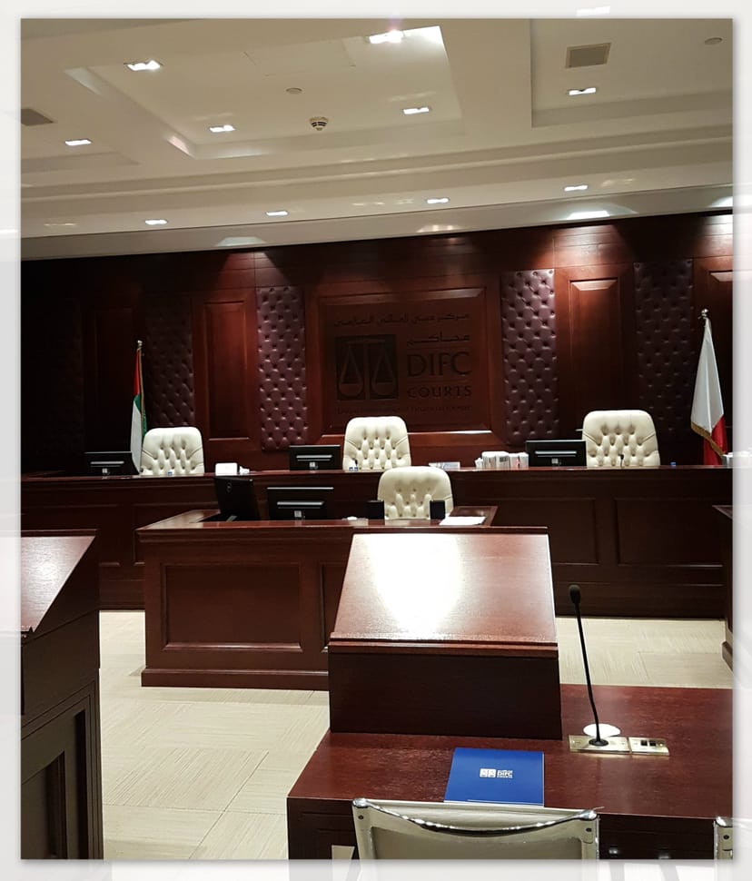 Formal DIFC courtroom with wood paneling for executive proceedings and legal arbitration.