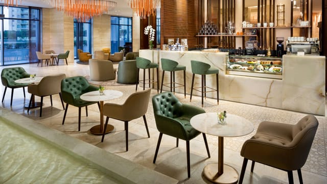 Upscale hotel suite lounge for business networking and conference breakout sessions.