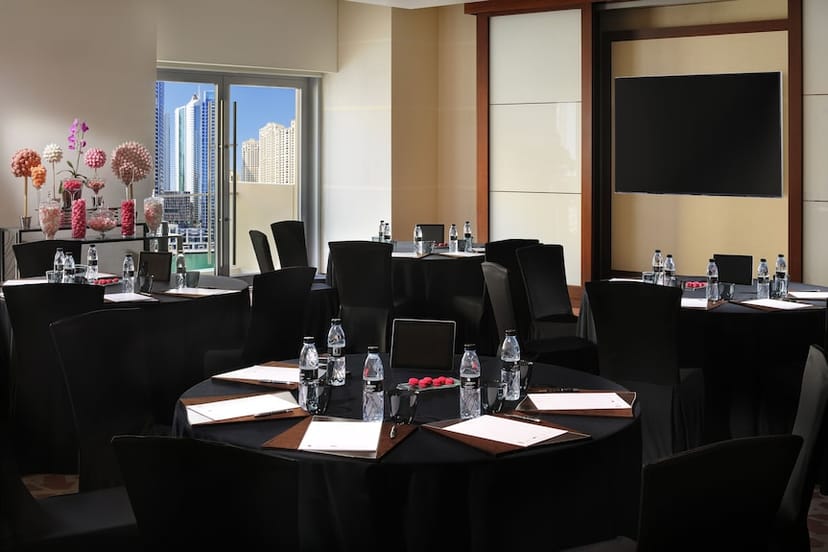 Boardroom setup with round tables at JW Marriott Marina for corporate meetings and event planning.