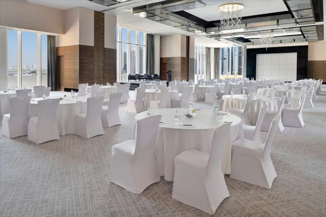 Luxury JW Marriott Marina ballroom with floor-to-ceiling windows for gala dinners and conferences.