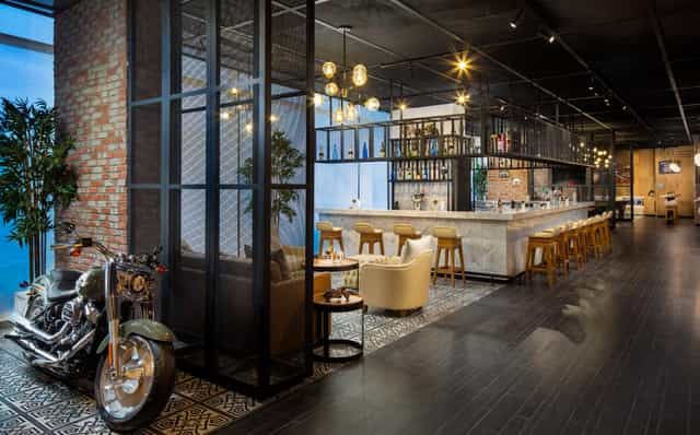 Motorcycle-themed Hills Meeting Room at Millennium Place Mirdif for VIP events and networking.