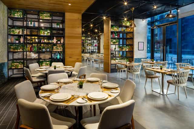 Modern Hills Meeting Room with stylish shelving for corporate dinners and networking events.