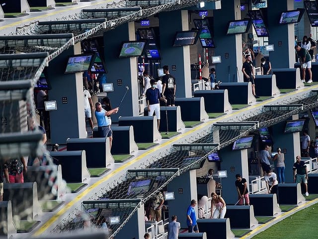 Emirates Golf Club driving range: interactive corporate team-building and networking event venue.