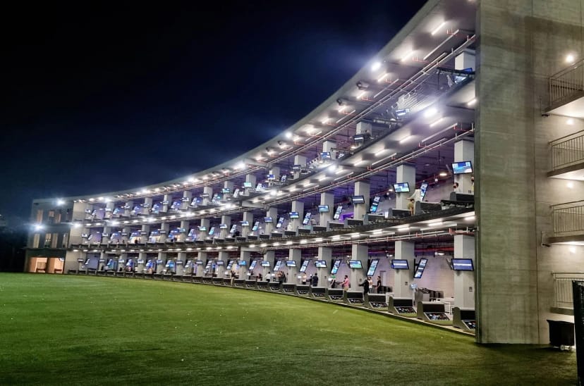 Emirates Golf Club driving range: multi-level venue for corporate networking and team building.
